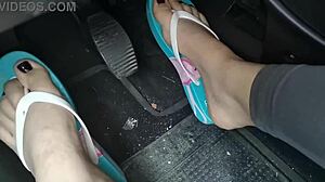 Amateur couple pedals a car while wearing barefoot flip flops and homemade heels